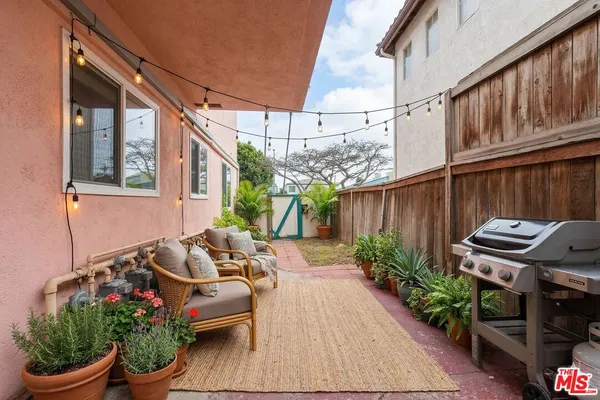 a backyard of a house with outdoor seating