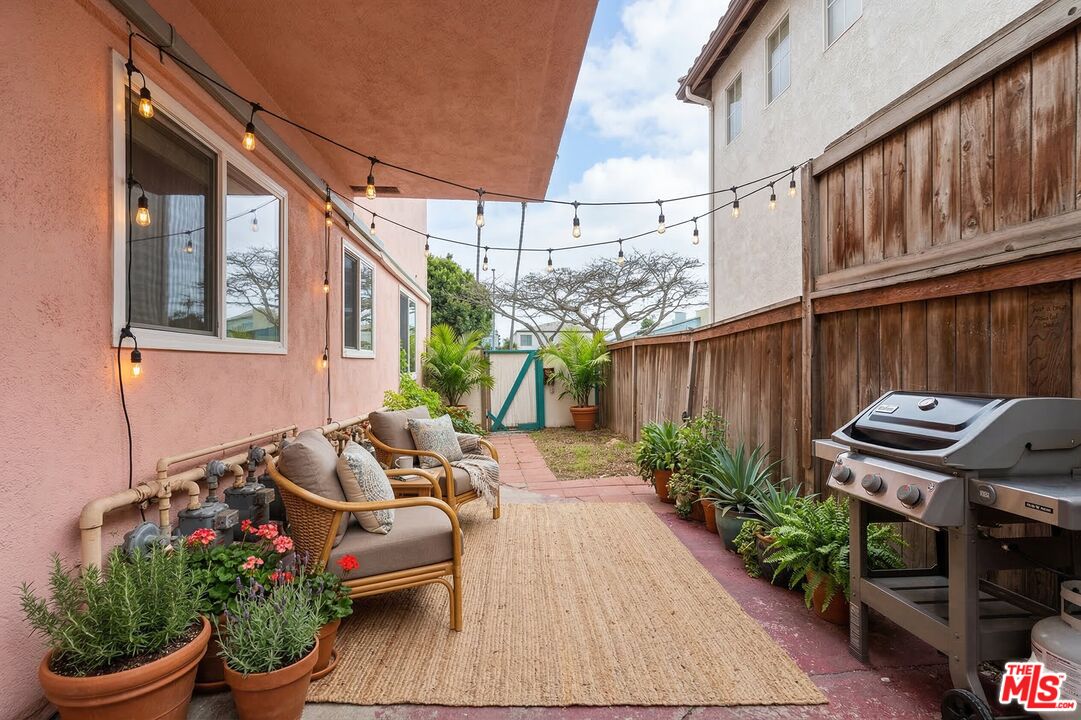 7825 West Manchester Avenue, Unit 10 Playa del Rey, CA 90293 - Photo 10 of 15 a backyard of a house with outdoor seating