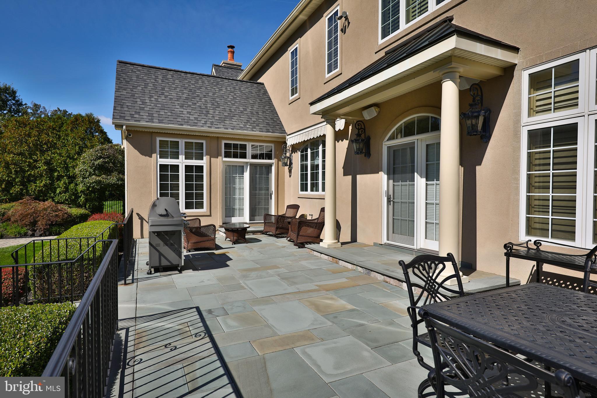 1011 Walton Road Blue Bell, PA 19422 - Photo 61 of 67 Bluestone terrace overlooks the pool