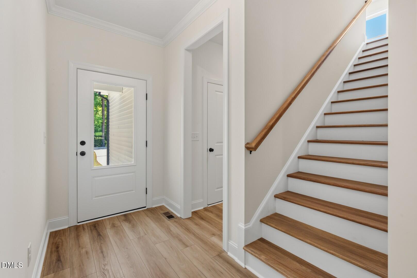 2251 Peachtree Hills Road Spring Hope, NC 27882 - Photo 8 of 46 a view of an entryway with wooden floor