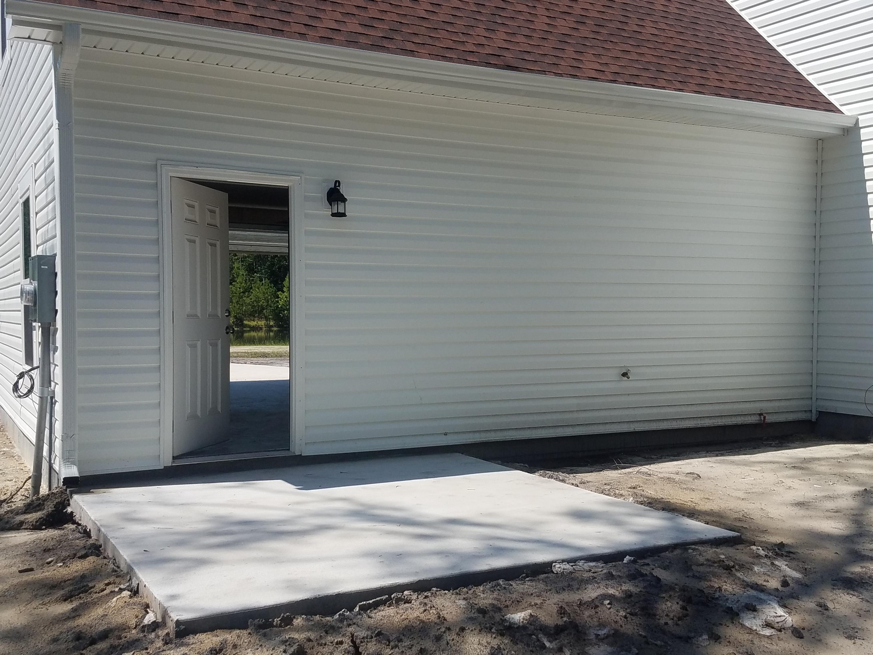 5914 Yellow Dog Road Ravenel, SC 29470 - Photo 24 of 28 small patio off garage