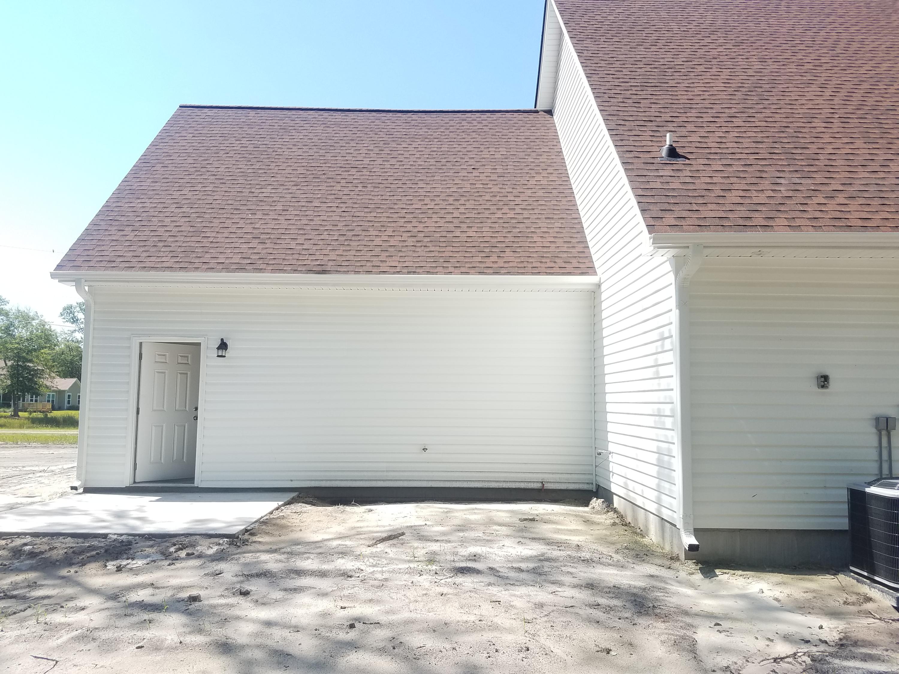 5914 Yellow Dog Road Ravenel, SC 29470 - Photo 25 of 28 garage from rear