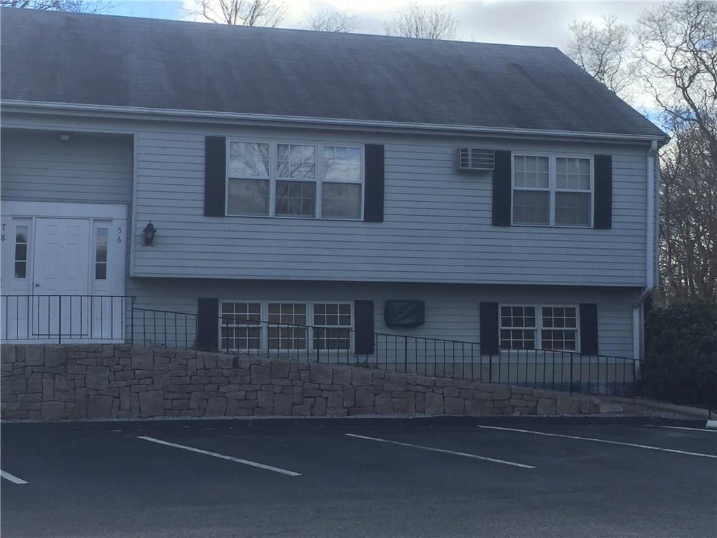 a front view of a house with garage