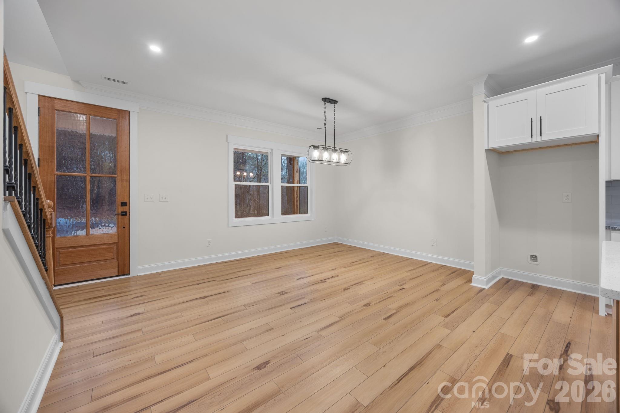 635 Fiber Acres A Street Cleveland, NC 27013 - Photo 12 of 42 an empty room with wooden floor and windows