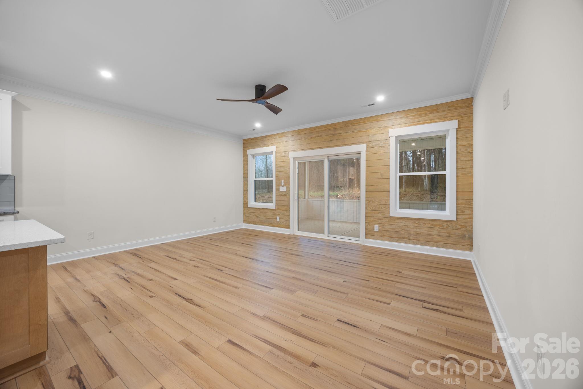 635 Fiber Acres A Street Cleveland, NC 27013 - Photo 15 of 42 a view of empty room with wooden floor and fan
