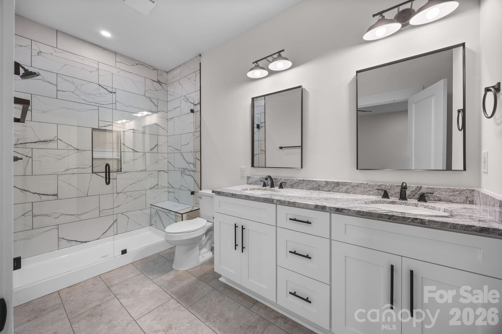 635 Fiber Acres A Street Cleveland, NC 27013 - Photo 21 of 42 a bathroom with a double vanity sink toilet and shower