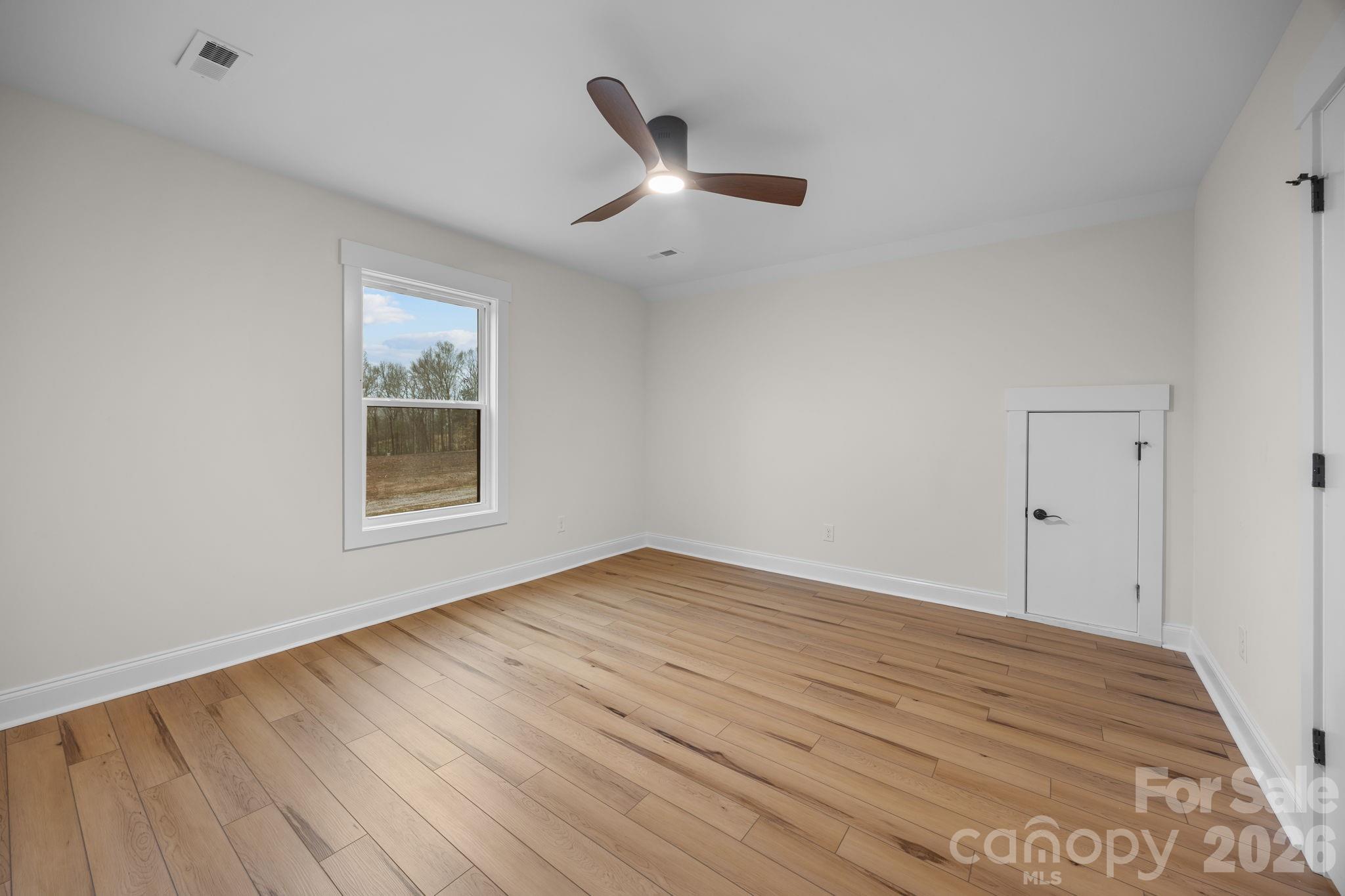 635 Fiber Acres A Street Cleveland, NC 27013 - Photo 37 of 42 wooden floor in an empty room with a window