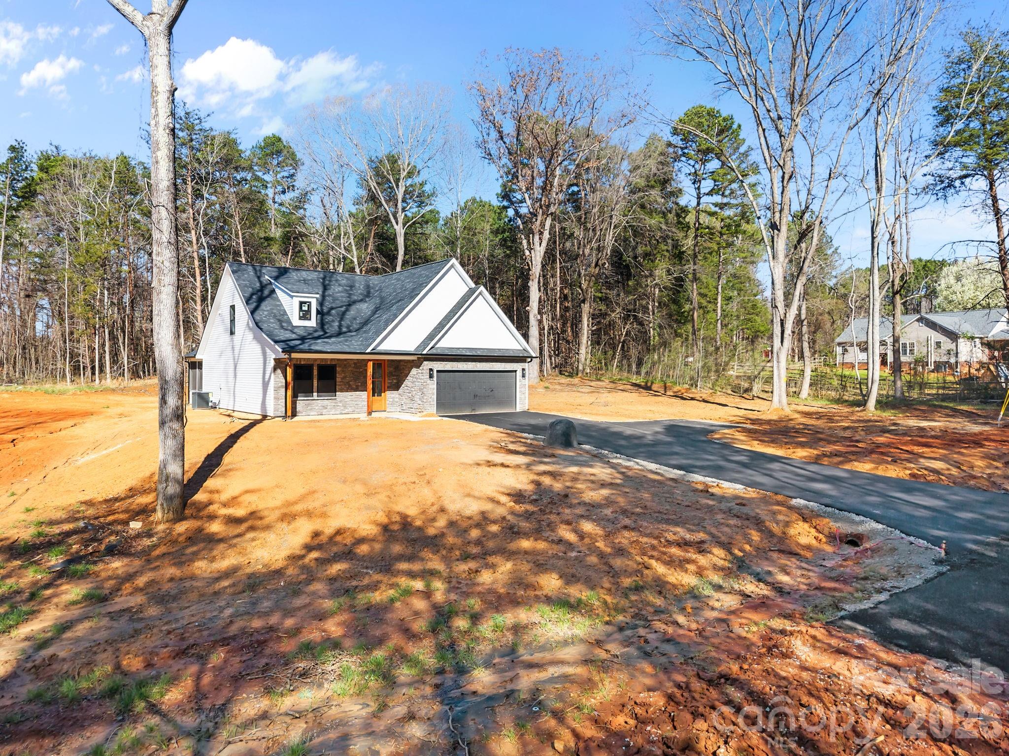 635 Fiber Acres A Street Cleveland, NC 27013 - Photo 38 of 42 a view of a house with a yard
