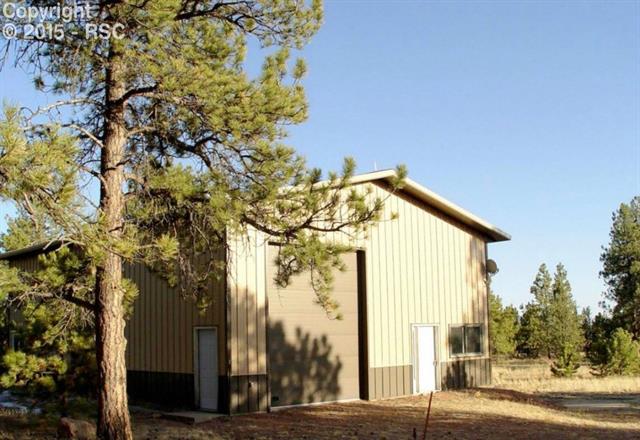 1095 Doe Valley Road Guffey, CO 80820 - Photo 2 of 21 This Morton building shop sits in a gorgeous treed setting on almost 36 acres of useable land