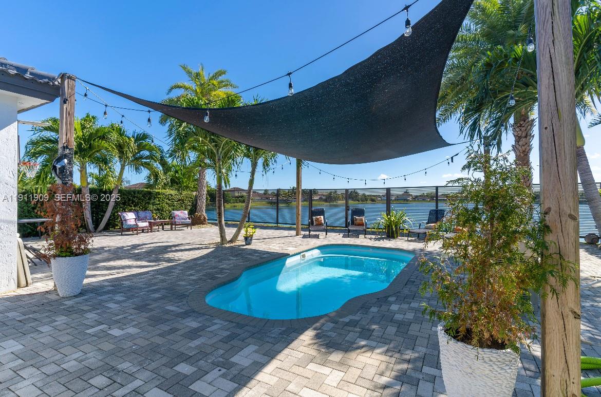 13000 Southwest 280th Street Homestead, FL 33033 - Photo 13 of 28 a view of a swimming pool with a patio
