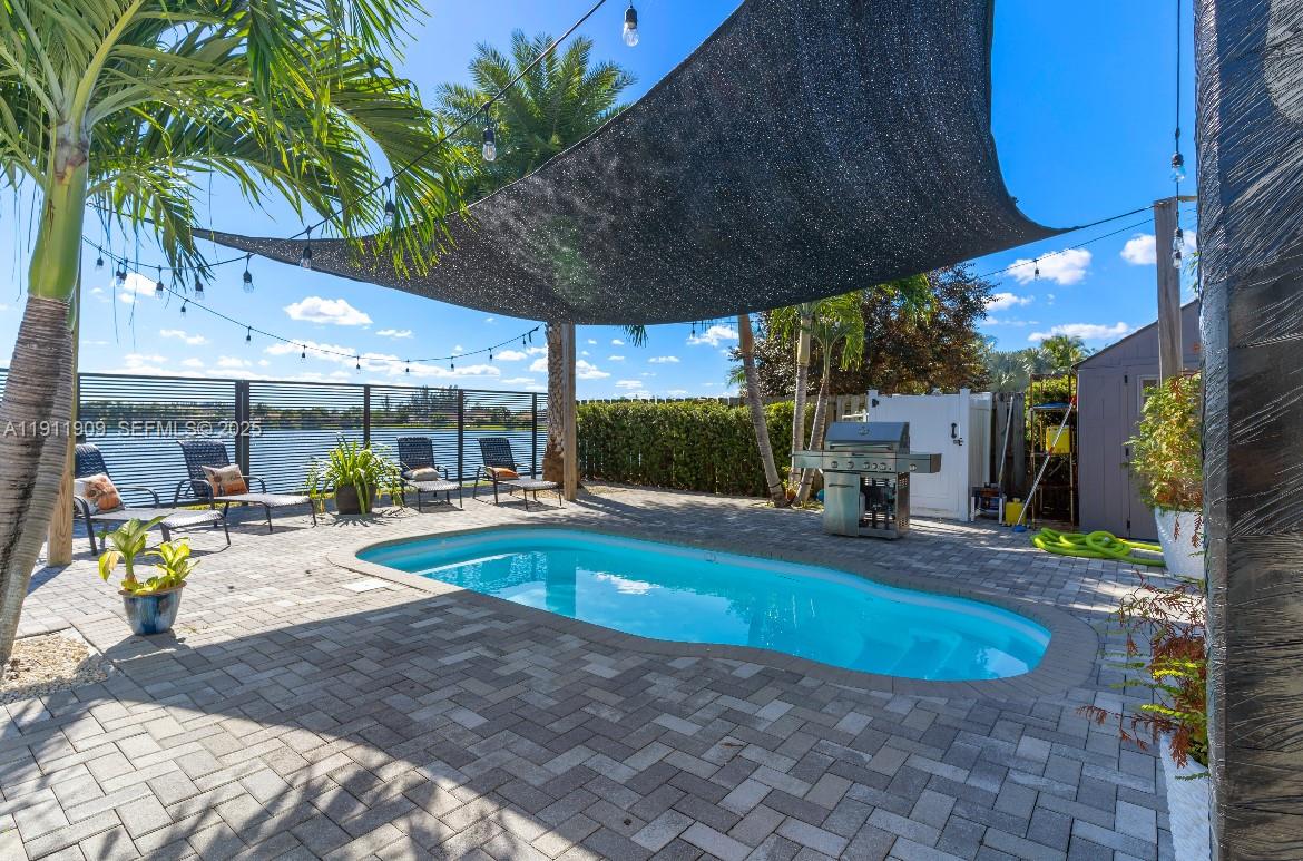 13000 Southwest 280th Street Homestead, FL 33033 - Photo 14 of 28 a view of a swimming pool with a patio