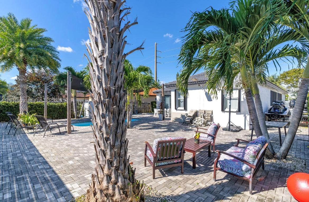 13000 Southwest 280th Street Homestead, FL 33033 - Photo 16 of 28 a view of a backyard with sitting area and furniture