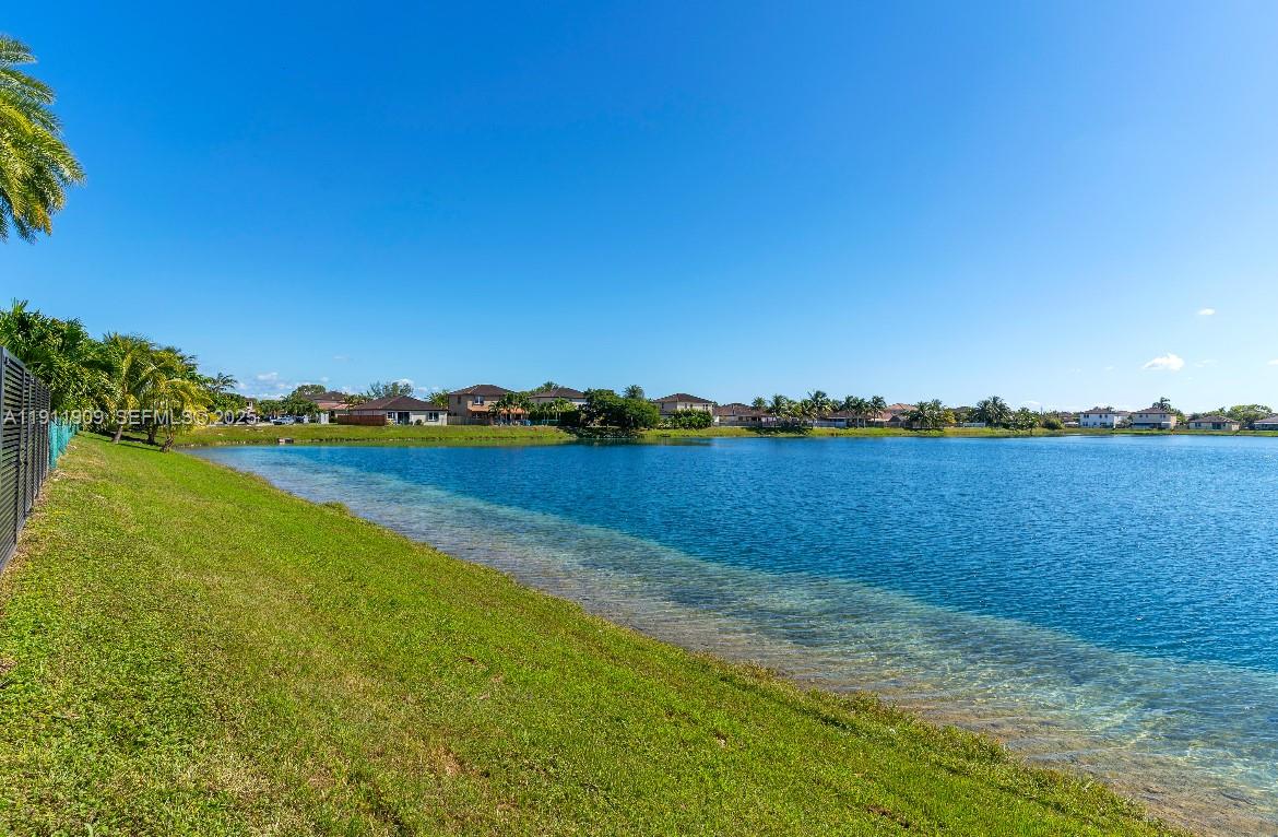 13000 Southwest 280th Street Homestead, FL 33033 - Photo 19 of 28 a view of a lake with houses in the back