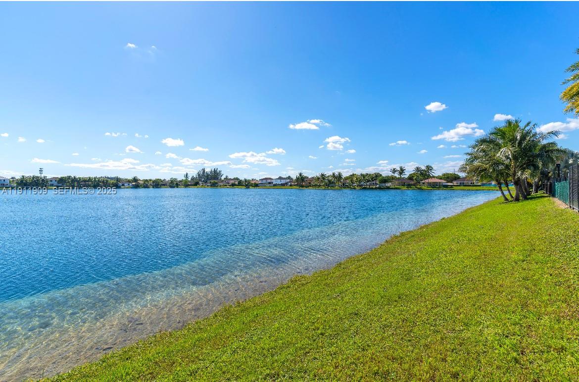 13000 Southwest 280th Street Homestead, FL 33033 - Photo 20 of 28 a view of a lake with houses in the back