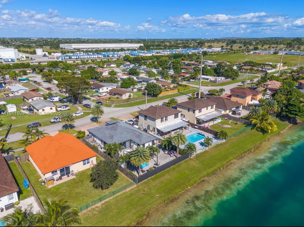 13000 Southwest 280th Street Homestead, FL 33033 - Photo 2 of 28 an aerial view of residential houses with outdoor space