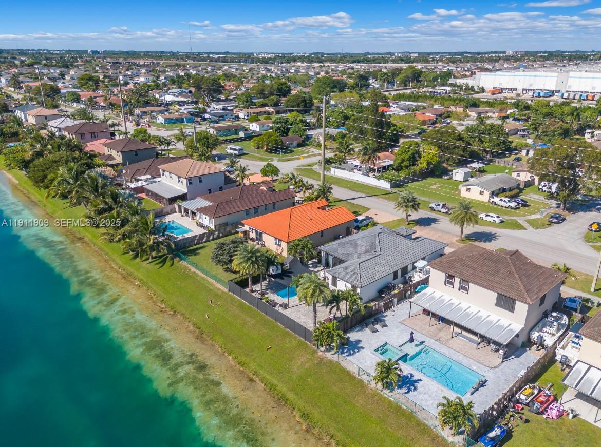 13000 Southwest 280th Street Homestead, FL 33033 - Photo 27 of 28 an aerial view of residential houses with outdoor space and river
