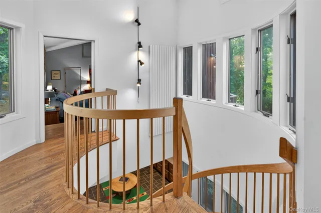 a bathroom with a window and a shower