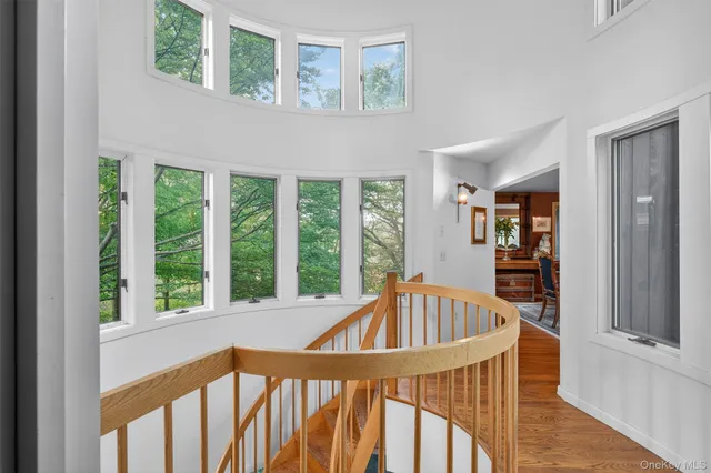 a wooden deck with trees in the backyard