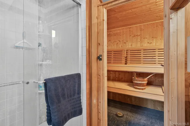 a living room with furniture a bookshelf and a fireplace