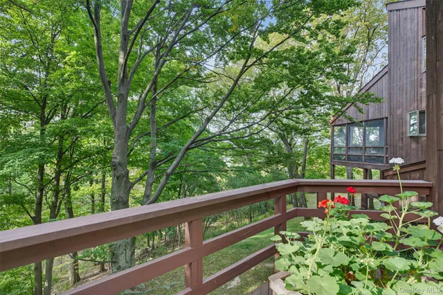 a room with furniture pool table and windows