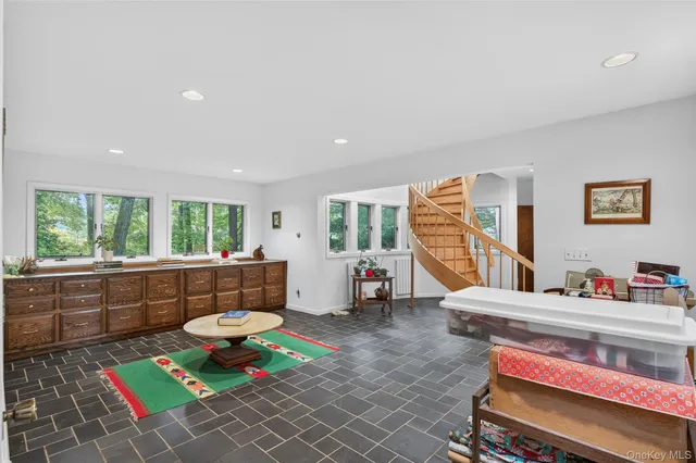 a view of walk in closet with clothes