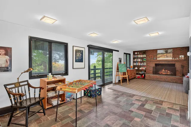 a bedroom with double bed and a window