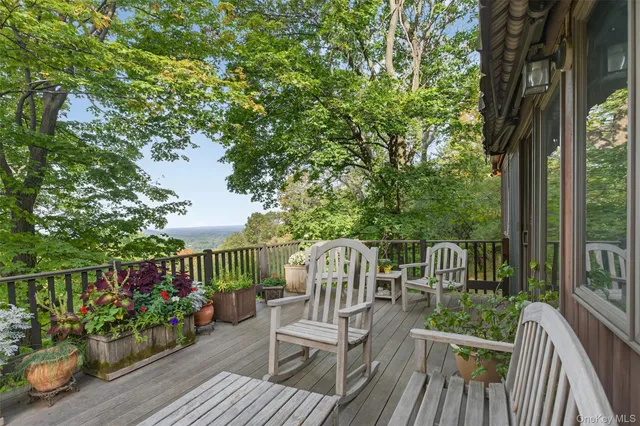 a view of a lush green hillside and a mountain