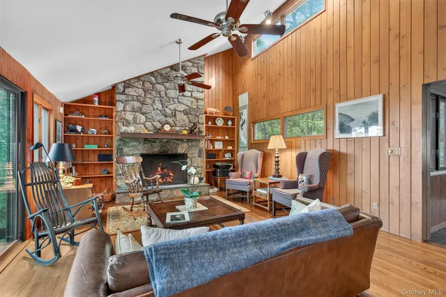 a kitchen with stainless steel appliances granite countertop a kitchen island a stove a table and chairs in it