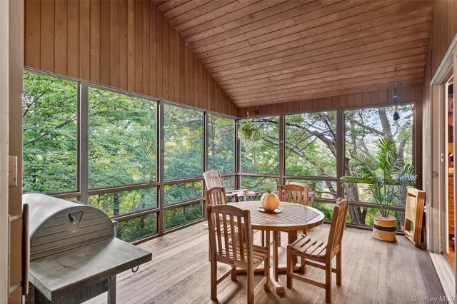 a view of balcony with furniture and staircase