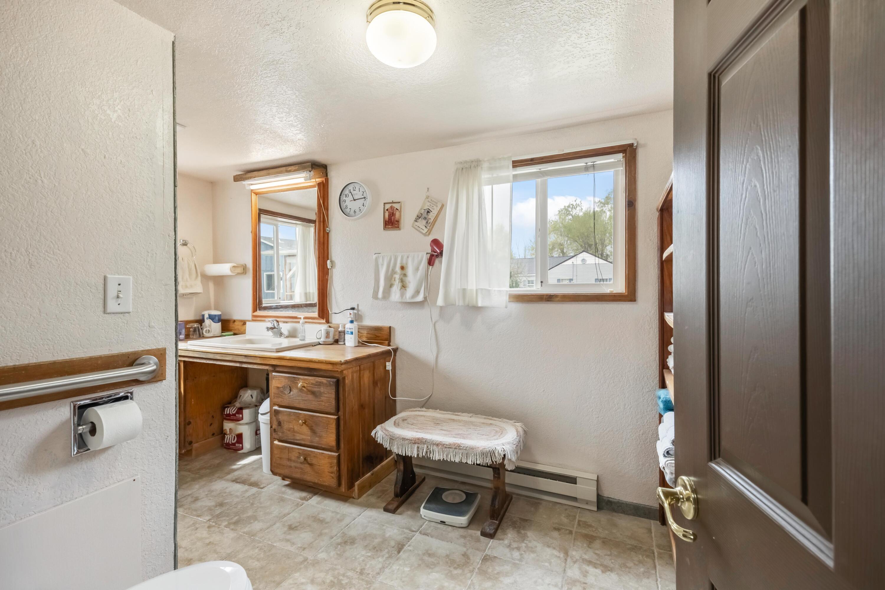 2010 Northeast Laughlin Road Prineville, OR 97754 - Photo 14 of 39 a view of a bathroom with a toilet sink and mirror