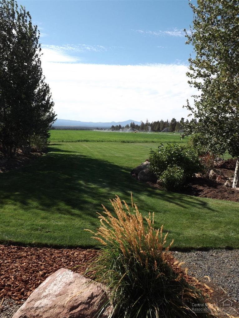 18665 Innes Market Road Bend, OR 97703 - Photo 11 of 23 a view of a golf course with a lake