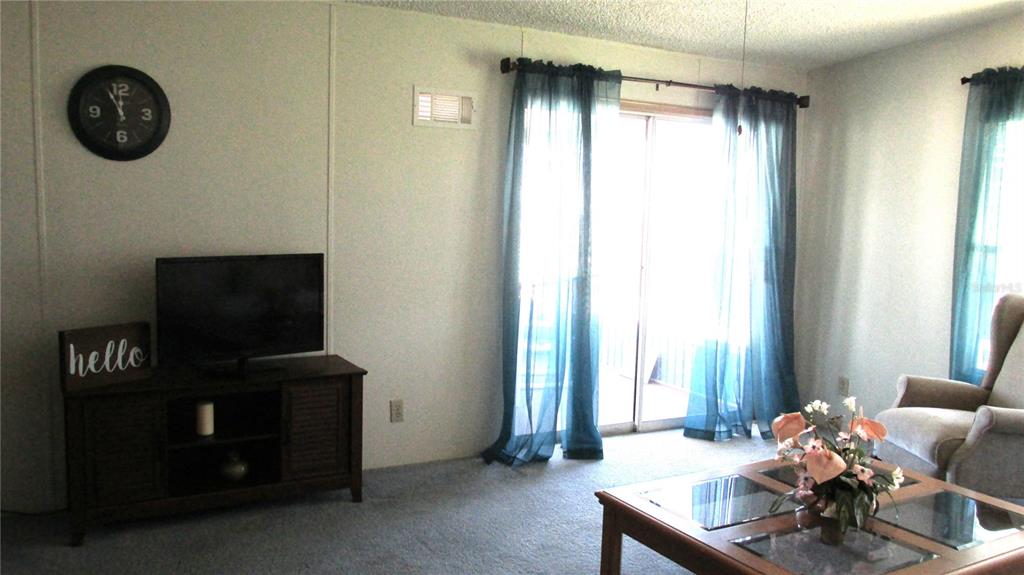 261 Ramsgate Way Haines City, FL 33844 - Photo 11 of 28 a living room with furniture and a window
