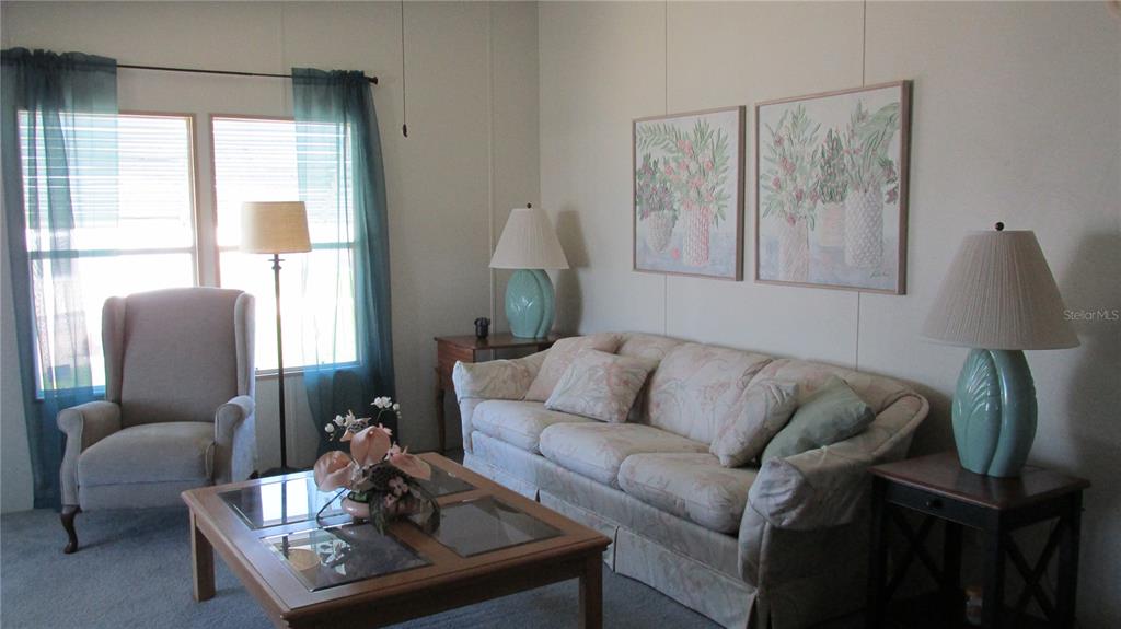 261 Ramsgate Way Haines City, FL 33844 - Photo 13 of 28 a living room with furniture and a window