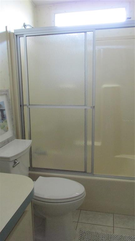 261 Ramsgate Way Haines City, FL 33844 - Photo 18 of 28 a white toilet sitting next to a bathroom sink