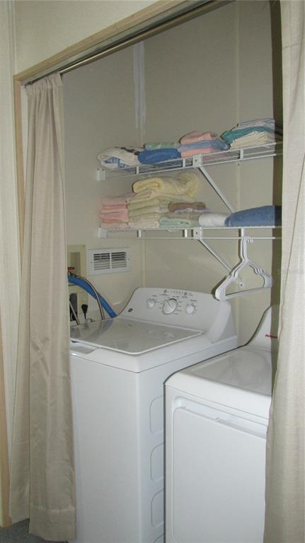 261 Ramsgate Way Haines City, FL 33844 - Photo 19 of 28 a utility room with dryer and washer