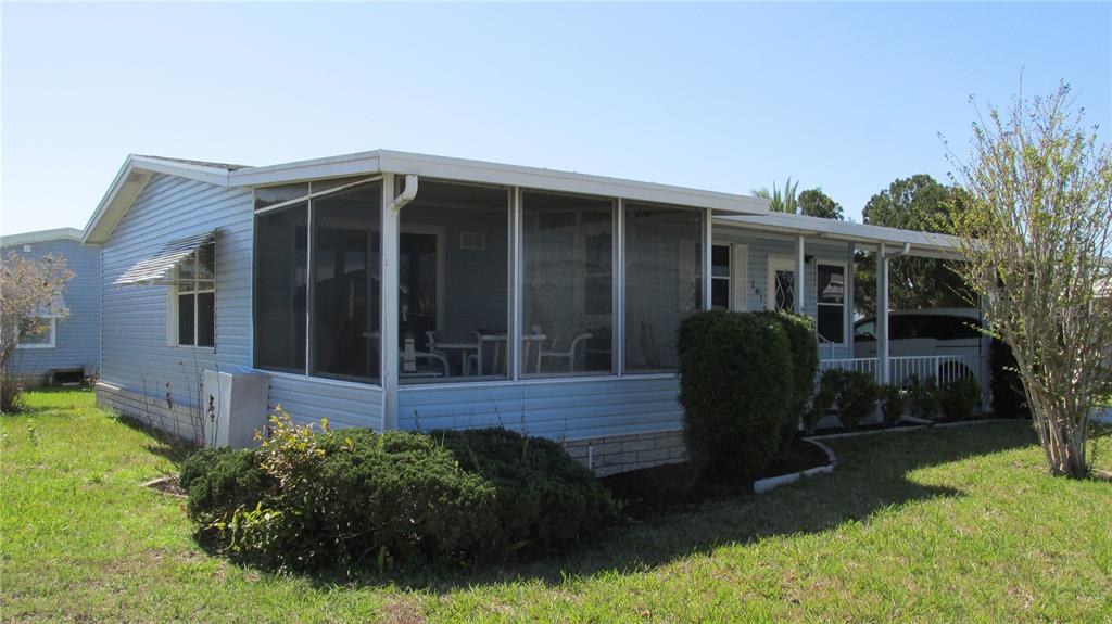 261 Ramsgate Way Haines City, FL 33844 - Photo 2 of 28 a view of a house with backyard and sitting area