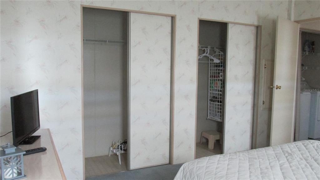 261 Ramsgate Way Haines City, FL 33844 - Photo 21 of 28 a bedroom with a bed and a flat screen tv