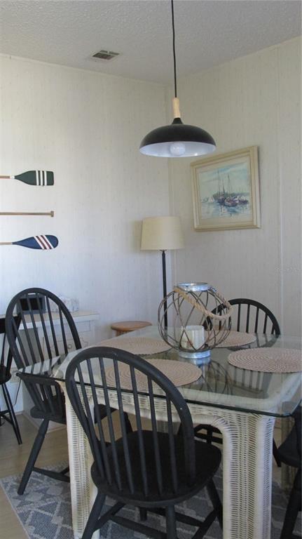 261 Ramsgate Way Haines City, FL 33844 - Photo 4 of 28 a table and chairs in a room