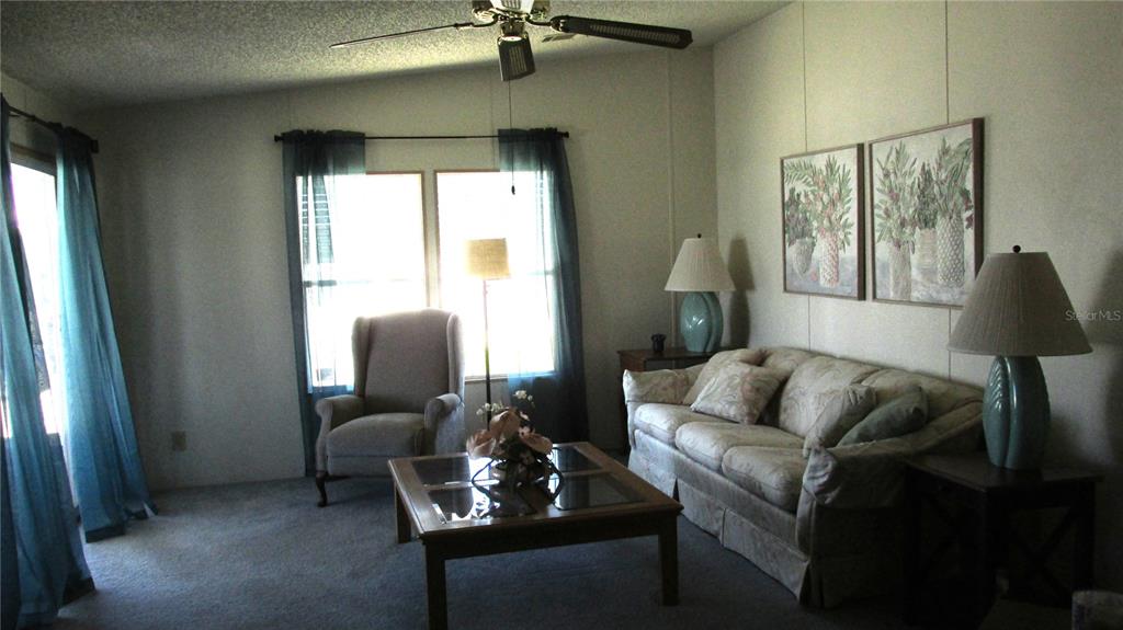 261 Ramsgate Way Haines City, FL 33844 - Photo 10 of 28 a living room with furniture and a window