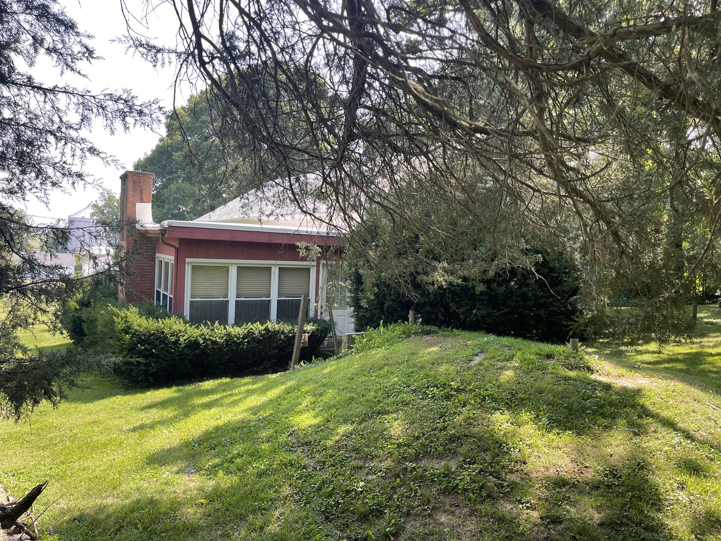 308 High Street Putnam, IL 61560 - Photo 2 of 21 a view of a house with garden and backyard
