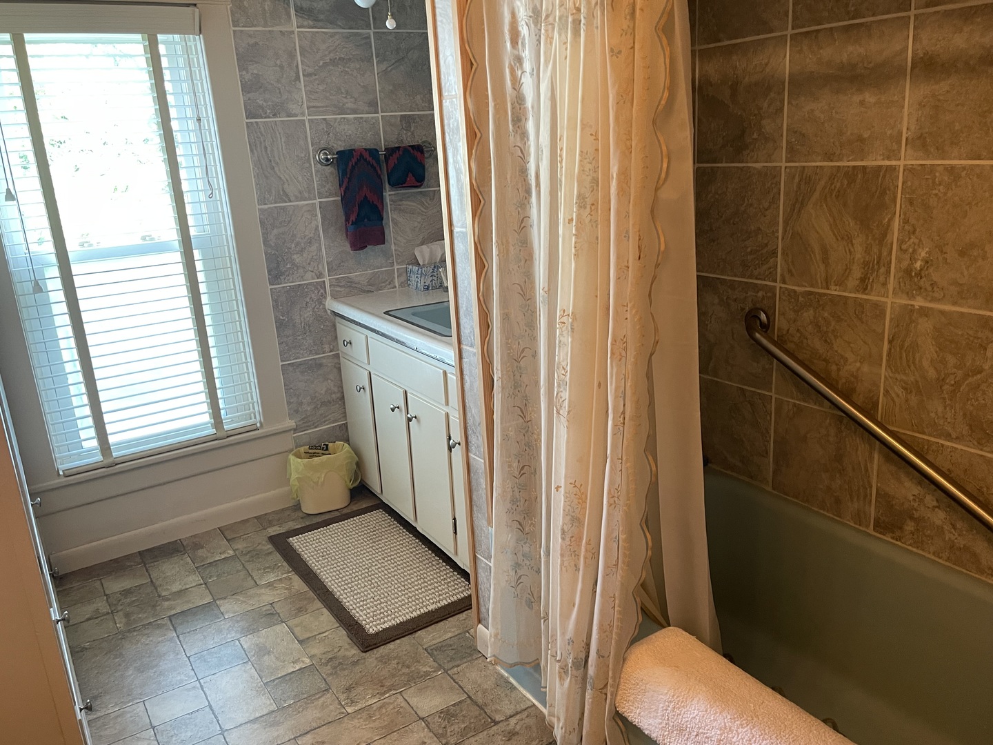 308 High Street Putnam, IL 61560 - Photo 5 of 21 a bathroom with a window and a shower