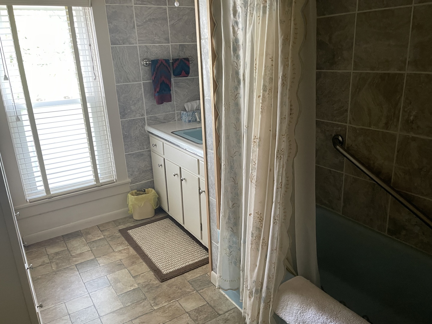 308 High Street Putnam, IL 61560 - Photo 6 of 21 a bathroom with a glass shower door