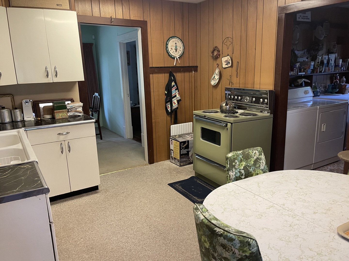 308 High Street Putnam, IL 61560 - Photo 7 of 21 a kitchen with stainless steel appliances a stove a refrigerator and cabinets