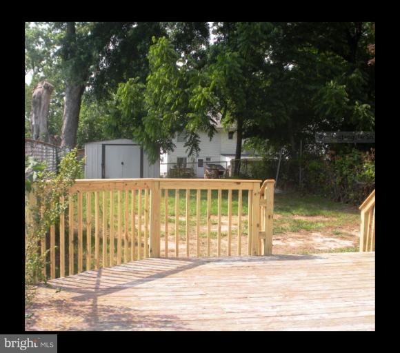 12008 Bluhill Road Silver Spring, MD 20902 - Photo 3 of 5 a view of a house with backyard and deck