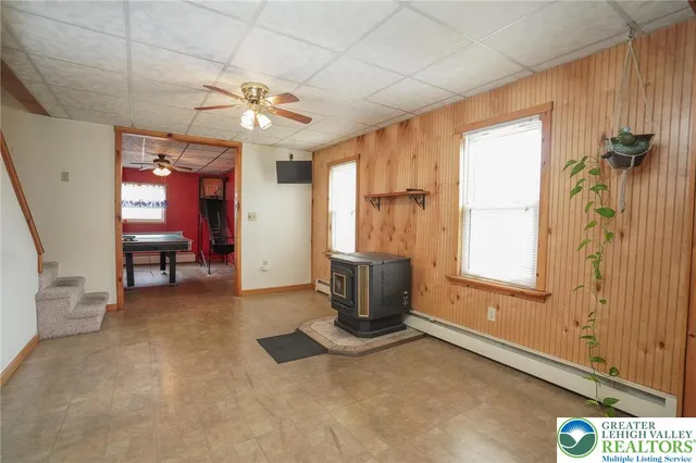 a view of a livingroom with furniture and a window