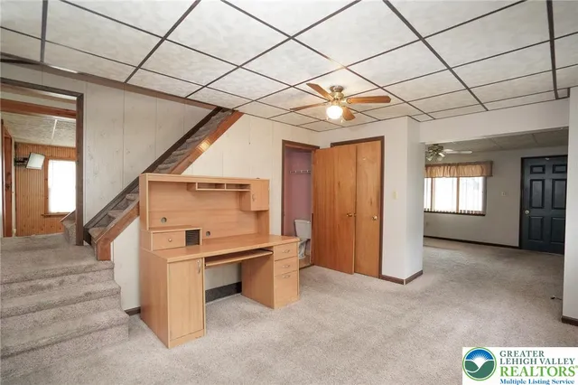 a view of a hallway with stairs