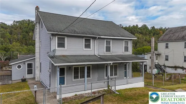 a house with river in front of it