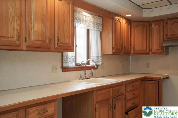 a kitchen with a sink and cabinets