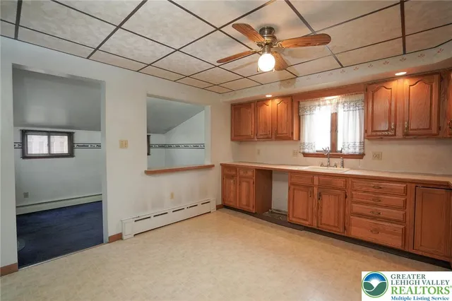 a bathroom with a sink a vanity and mirror