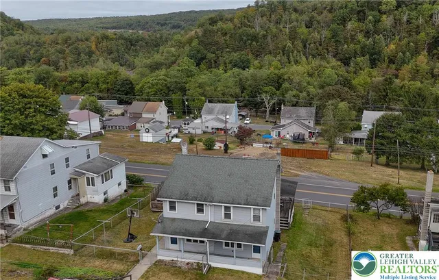 an aerial view of residential houses with outdoor space